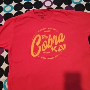 The Cobra Kai Graphic Tee - Pink with Yellow Logo